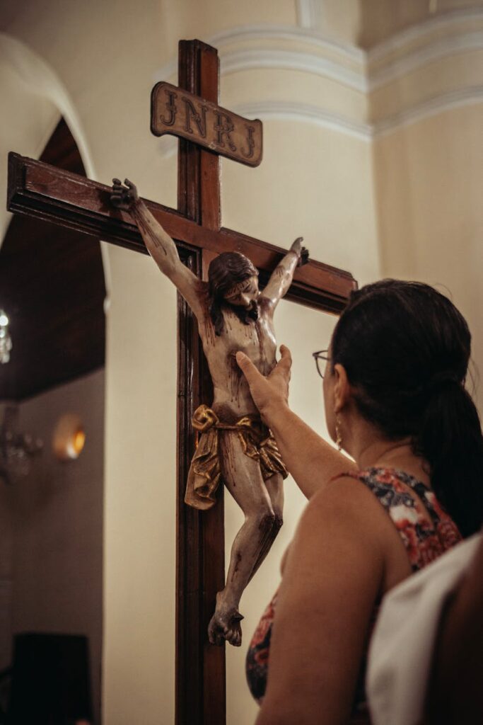 woman touching crucified jesus christ