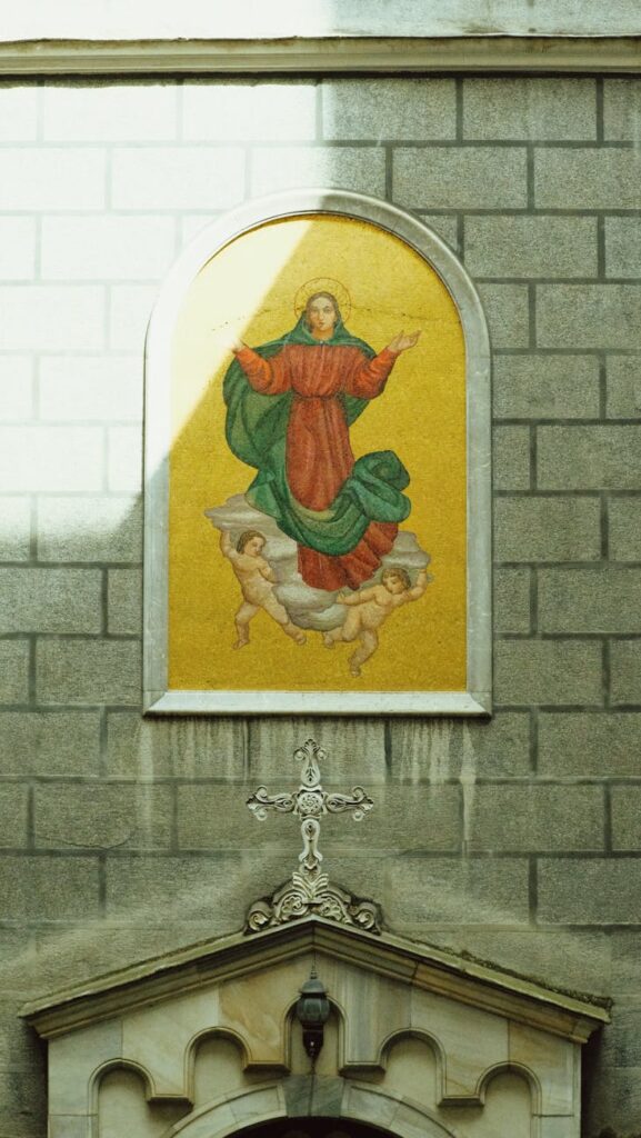 painting of mary virgin on wall over entrance