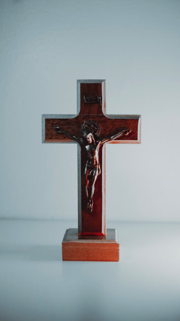 brown wooden cross on white table